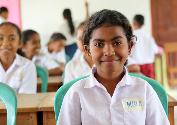 A girl sits in her classroom