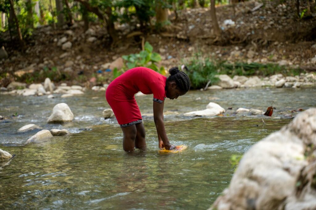 Sofiana, 13, collects water from a river that is an hour's walk from her home