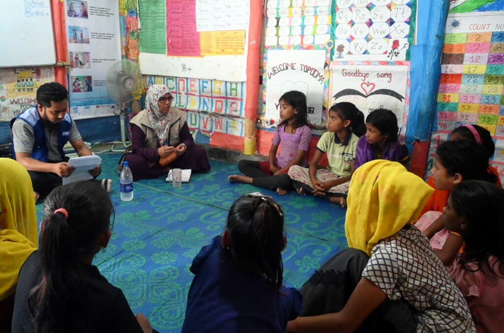 Plan staff members meet with girls in Teknaf, Cox’s Bazar district 