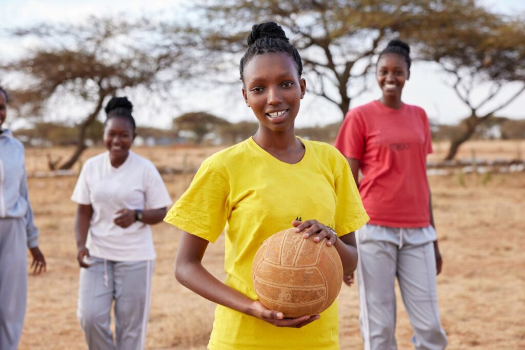 Poria playing ball at school