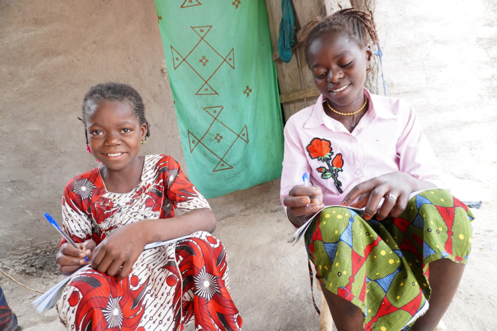 Diatou and her older sister at home